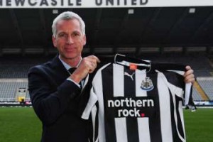 Alan Pardew with Newcastle United shirt.